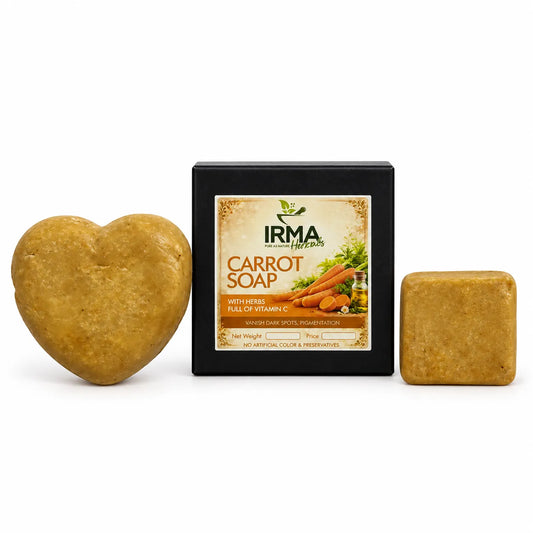 Heart-shaped and square bars of Irma Naturals Carrot Soap displayed next to their black packaging box on a white background.
